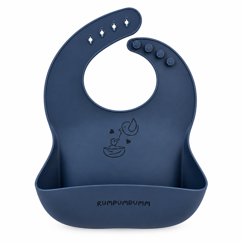 In the set: Food Catching Bib in Midnight Blue, front, showing the food-catching pocket